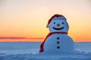 bigstock-snowman-on-orange-sunset-backg-51774376